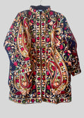 Colorful embroidered jacket on a gray background
